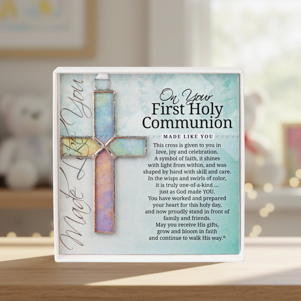 First Holy Communion cross on a shelf in a child's room.