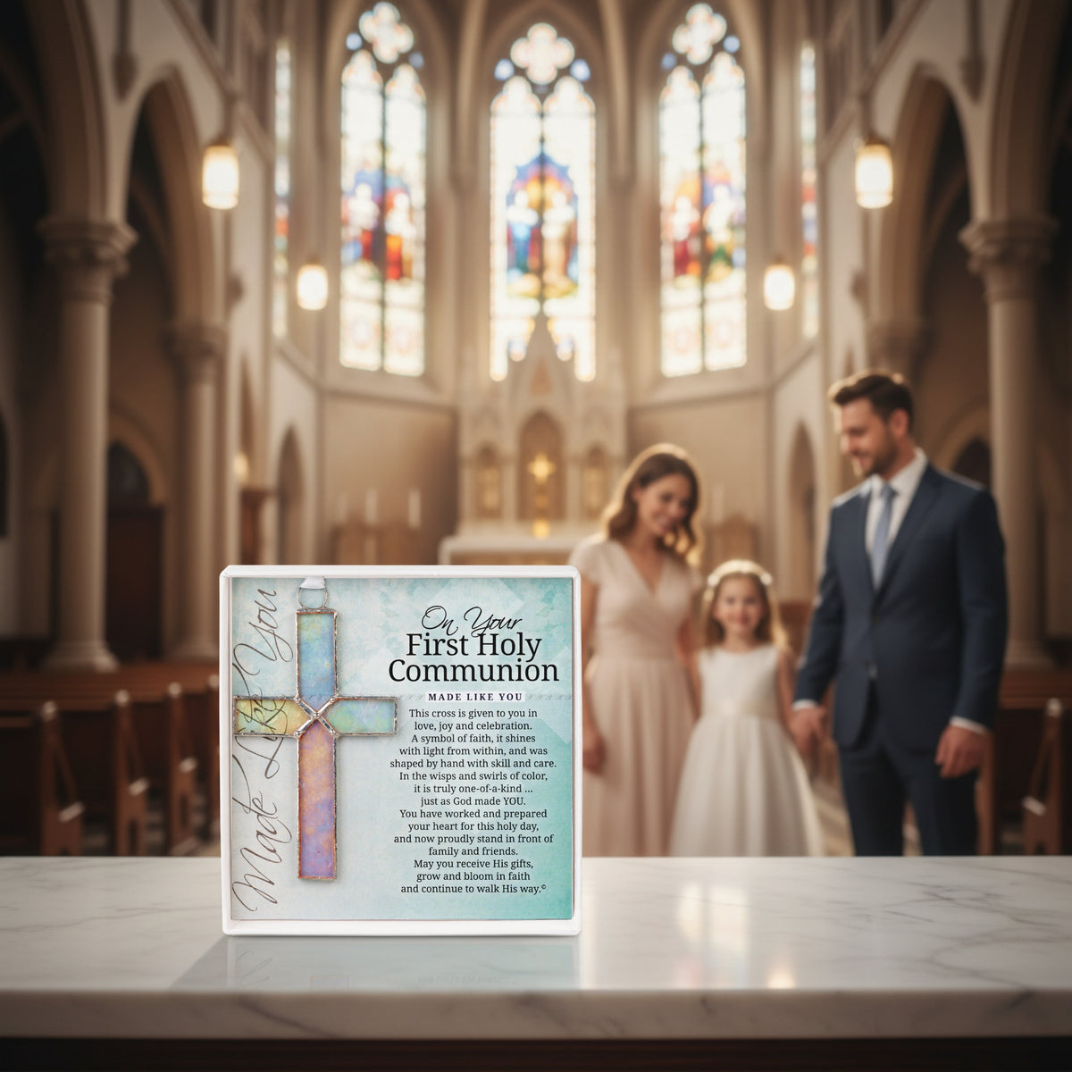 Parents celebrating their child's First Holy Communion with the product displayed in front of them.