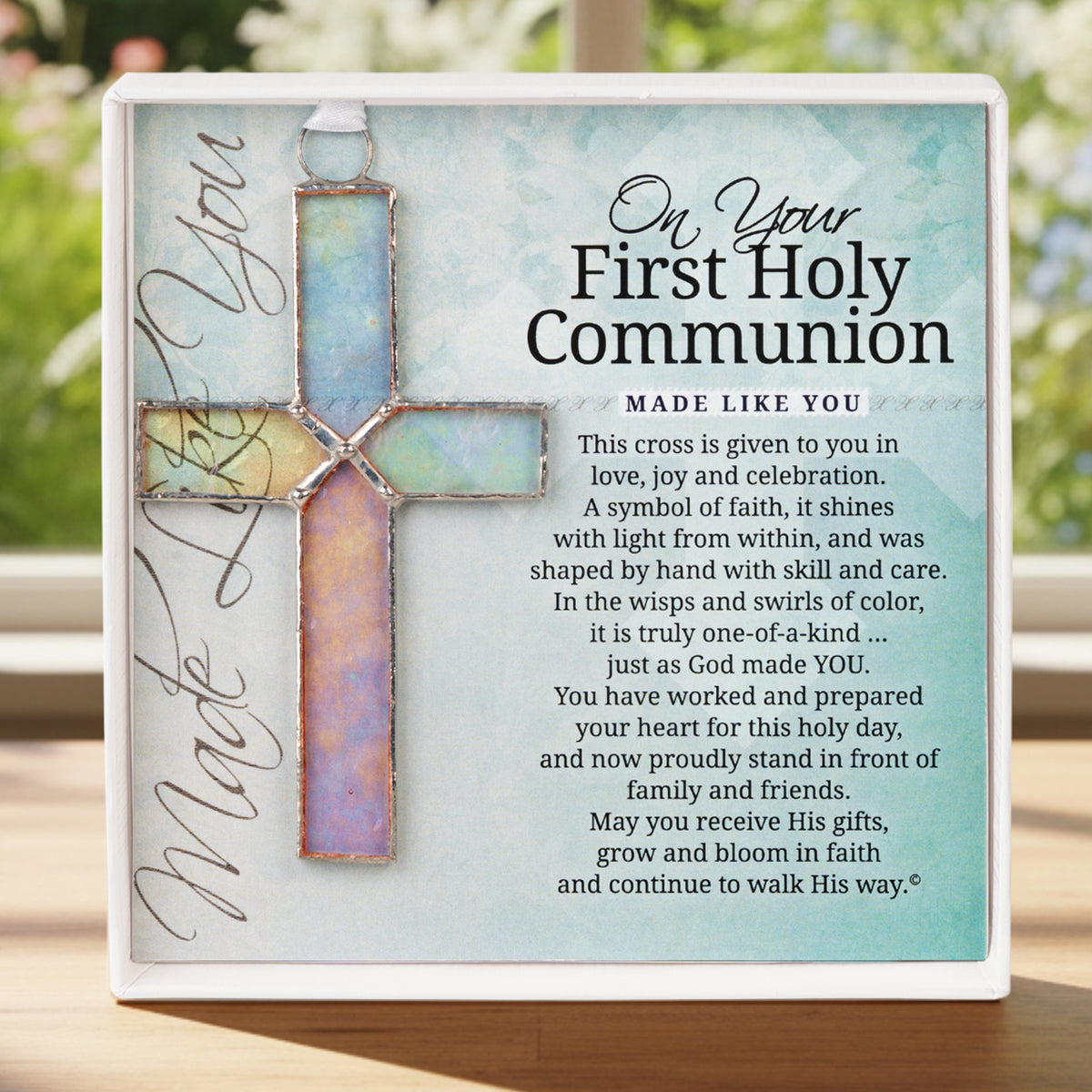 First Communion Gift - 4 1/4" clear iridescent stained glass cross and "On Your First Holy Communion" sentiment in white box with clear lid.