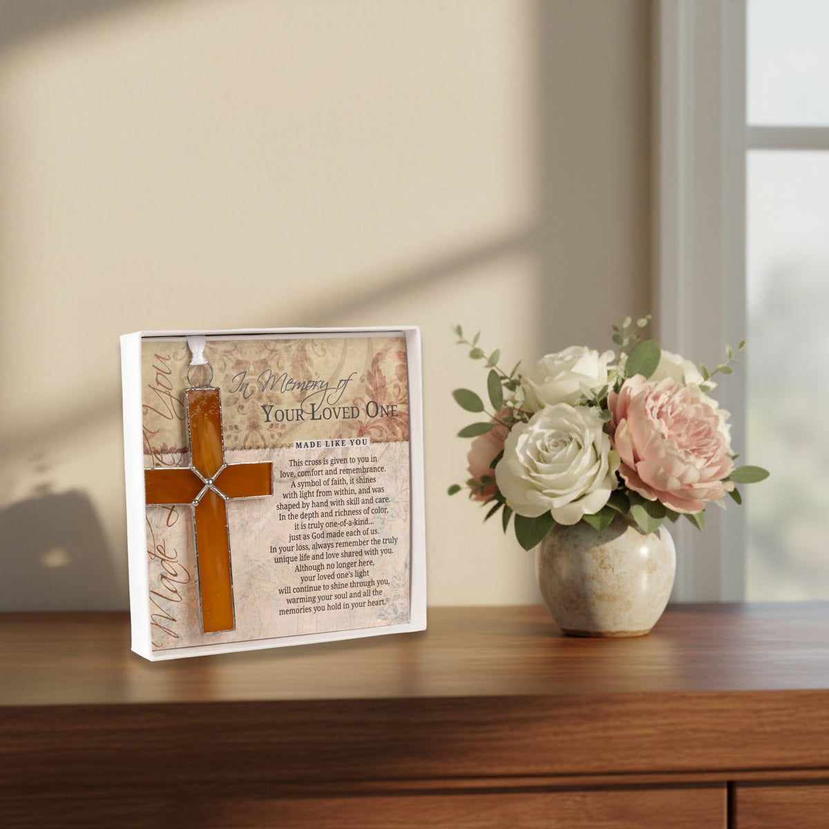 Gift displayed next to flowers.