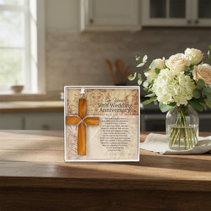 4 of 4:Anniversary gift displayed on a table next to flowers.