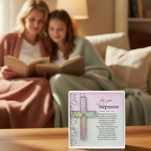 2 of 5:A stepmom and her stepdaughter reading on the sofa behind the Stepmom cross gift.