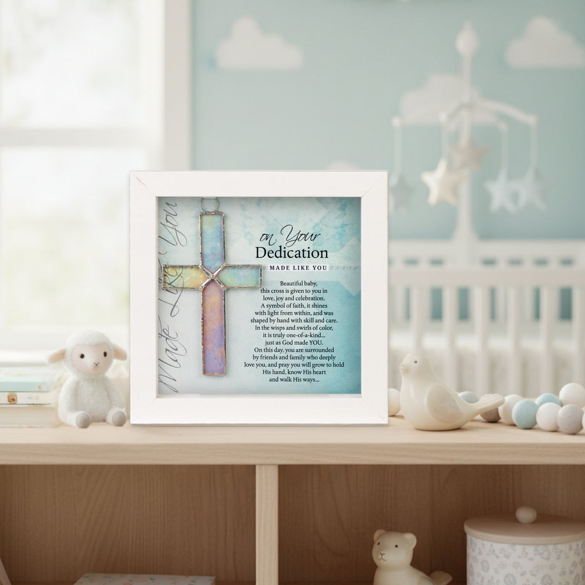 Framed Dedication Cross Gift in a nursery setting.