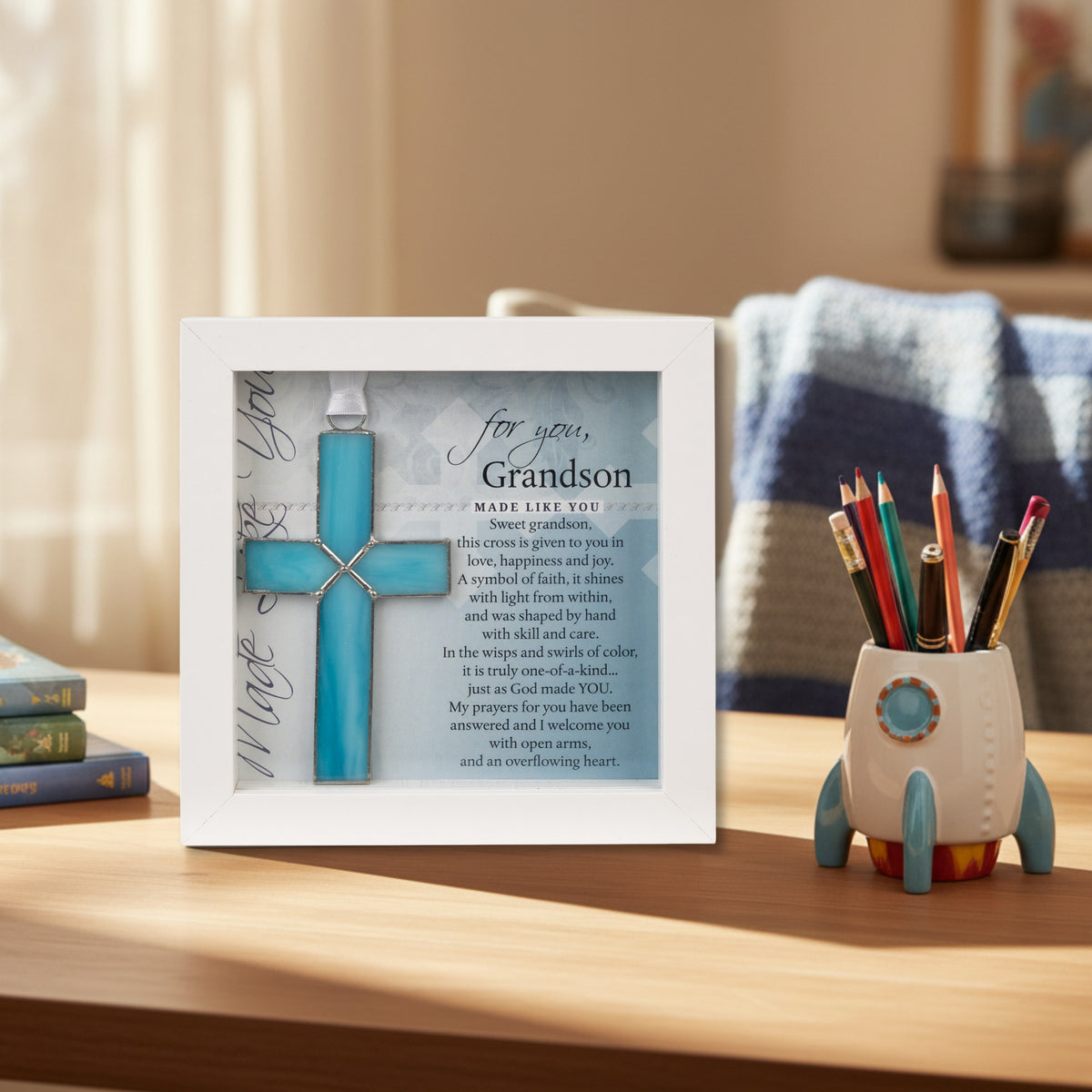 Framed Grandson Cross on a boy's desk.