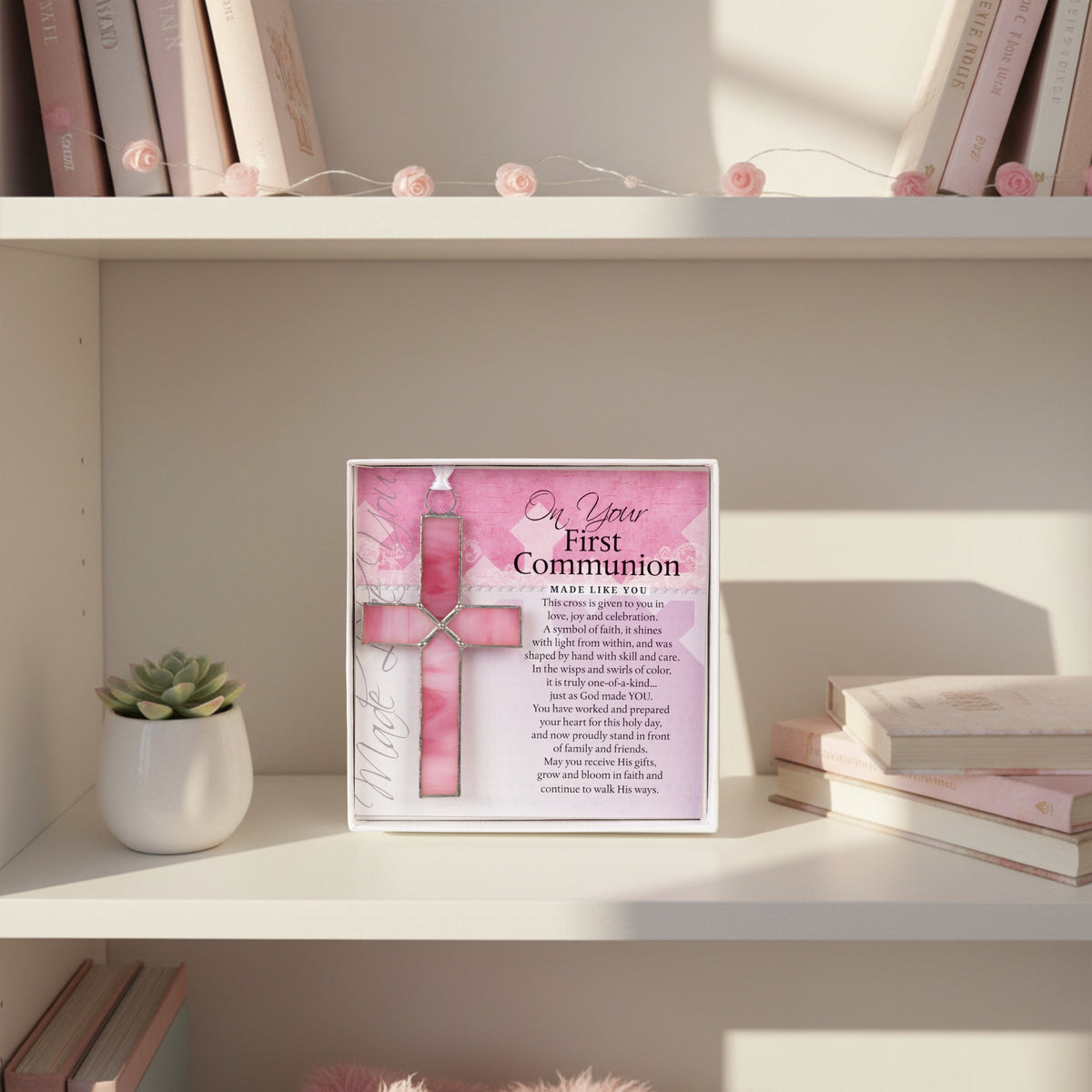 First Communion gift displayed on a girl's bookshelf.