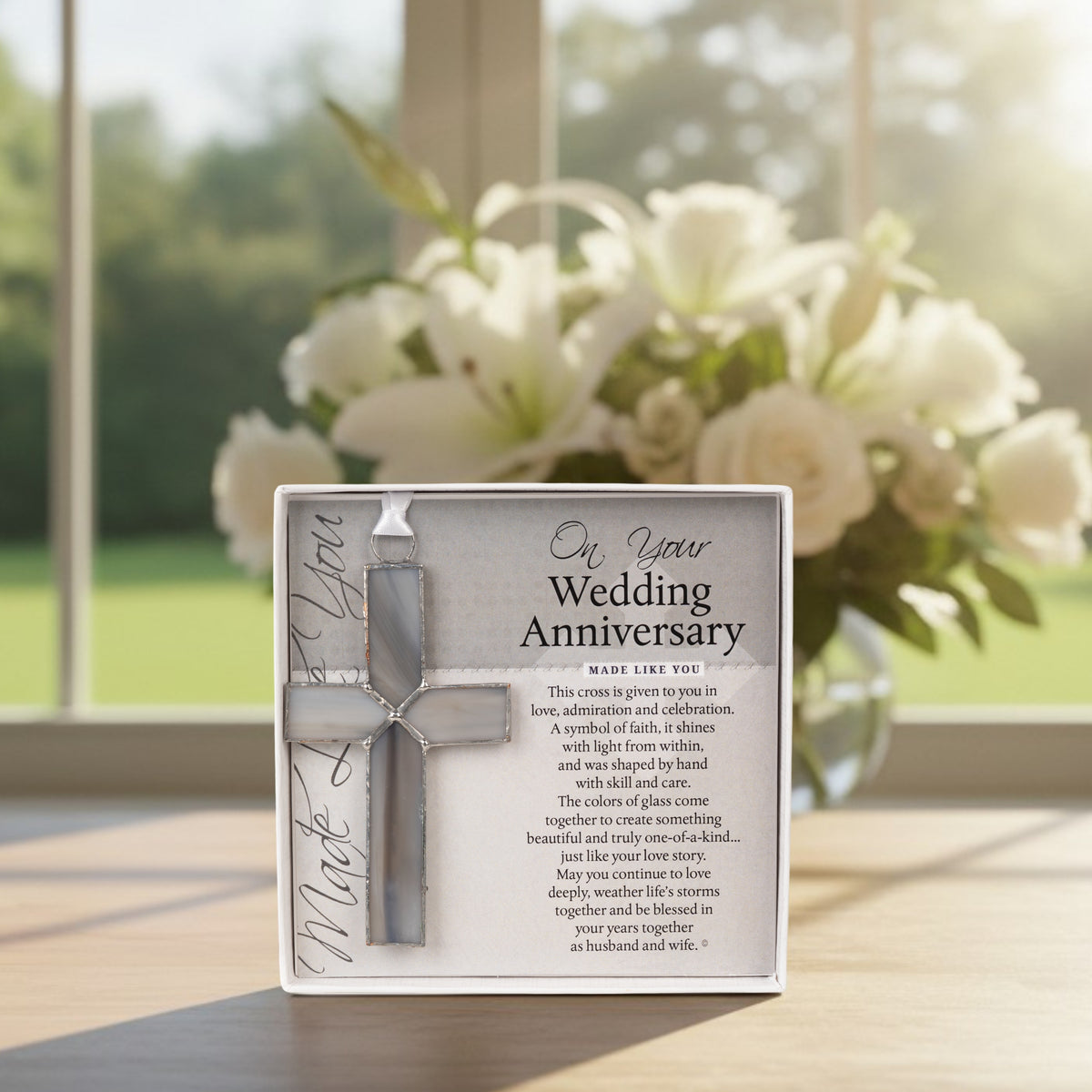 Wedding Anniversary gift displayed in front of flowers.