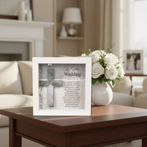 2 of 5:Wedding Day gift displayed on a coffee table with flowers.