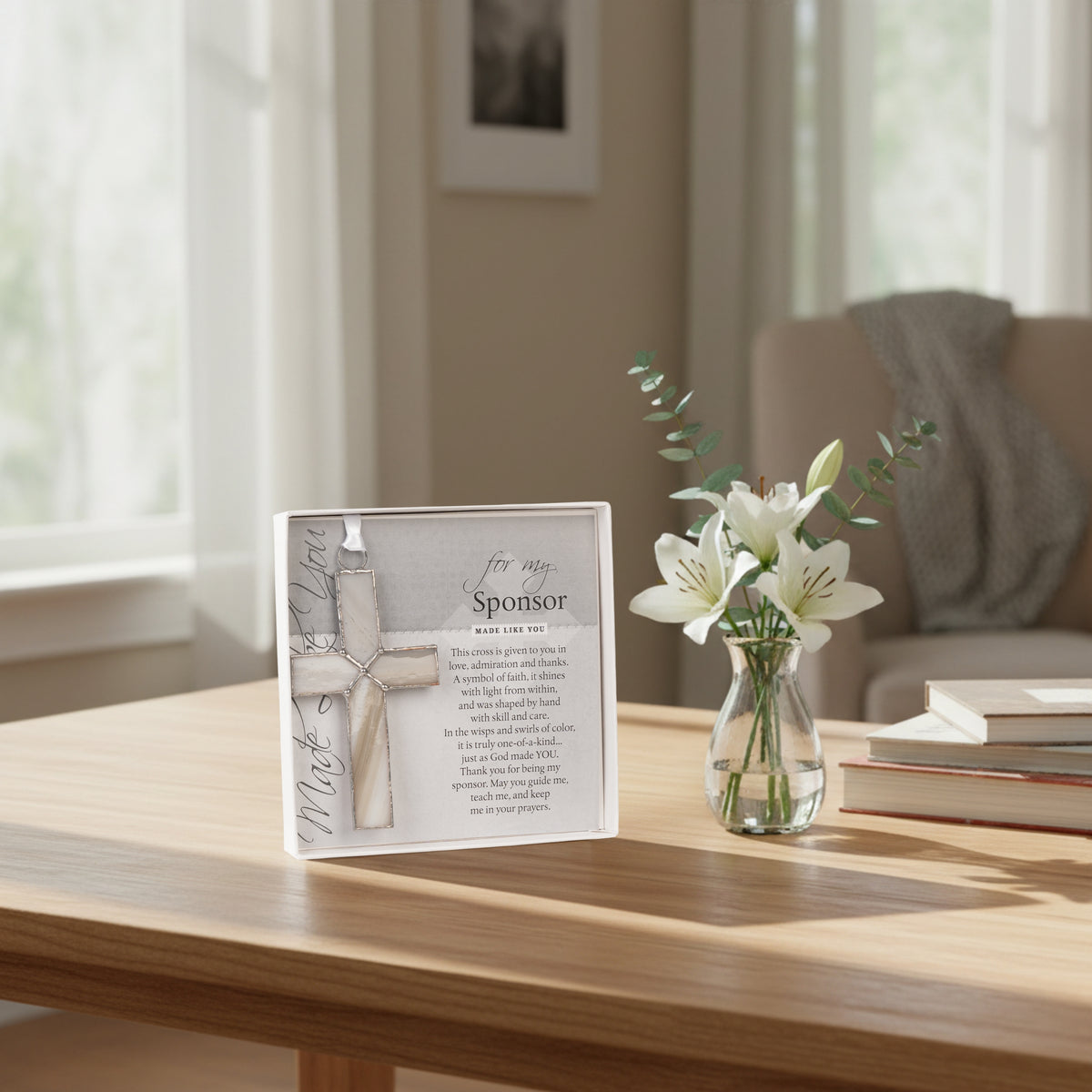 Gift for Sponsor displayed next to a vase of flowers. 