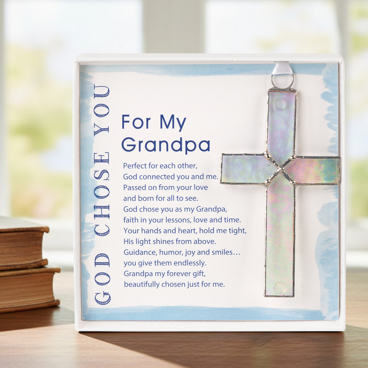 Cross gift for grandpa on a grandfather's desk.
