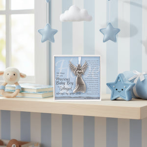 2 of 4:Gift sitting on a shelf in a baby boy's room.
