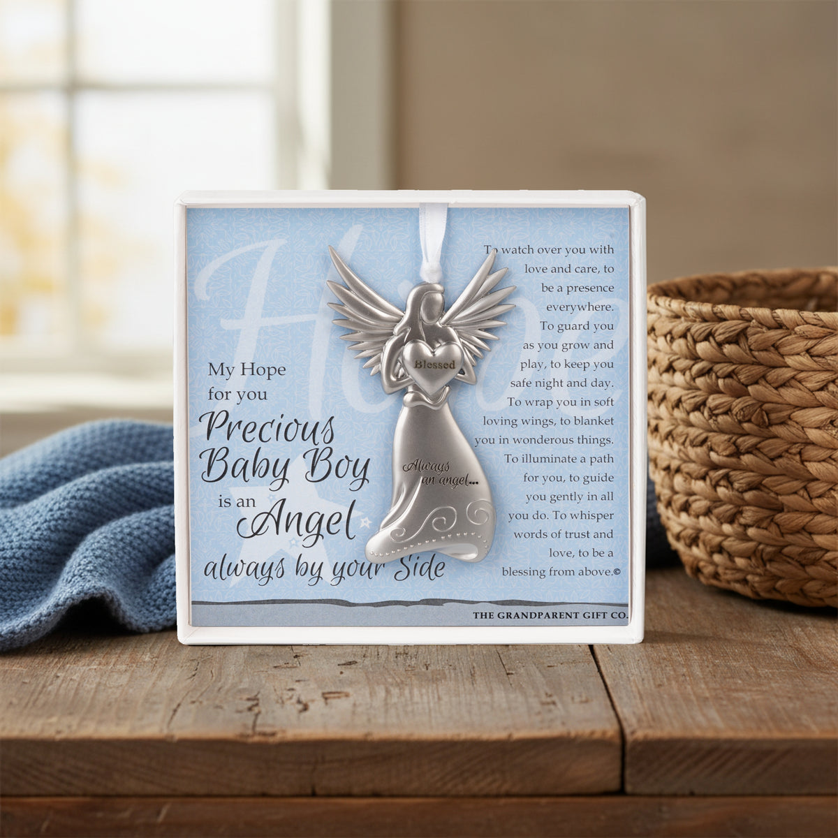 Baby Boy gift sitting on a table with a blanket and basket.