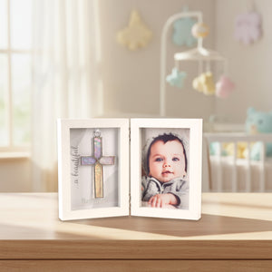 4 of 5:Baptism frame on a shelf in a baby's room.