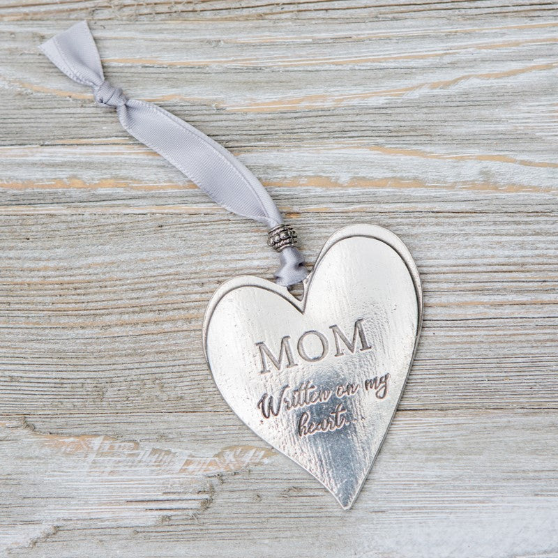 Pewter heart laying on a table - Click to shop our Pewter Gifts