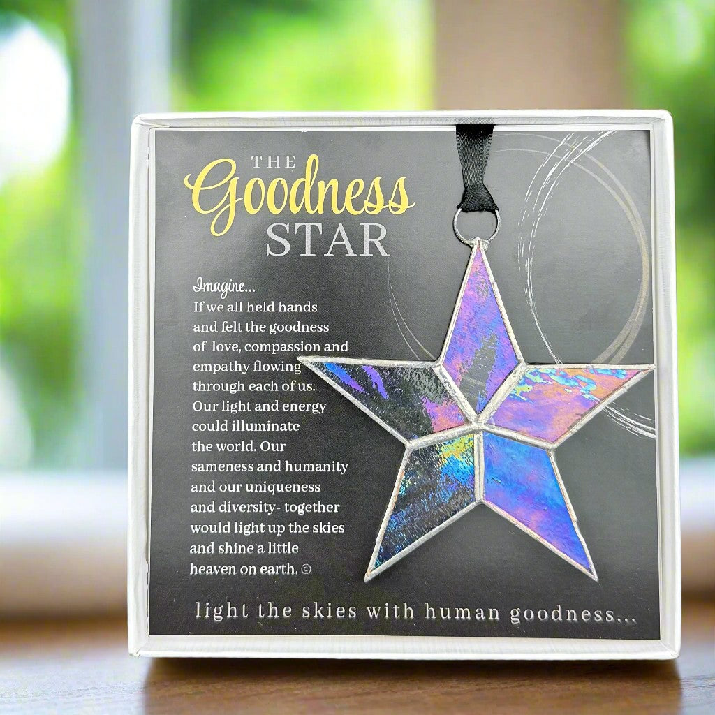 Handmade 4&quot; clear iridescent stained-glass star with silver edging, packaged with &quot;The Goodness star&quot; sentiment in white gift box with clear lid.