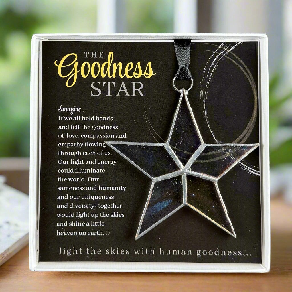 Star-shaped ornament with artwork featuring a sentiment about goodness and compassion.