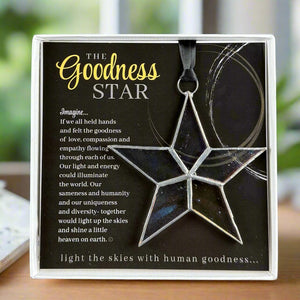 2 of 7:Star-shaped ornament with artwork featuring a sentiment about goodness and compassion.