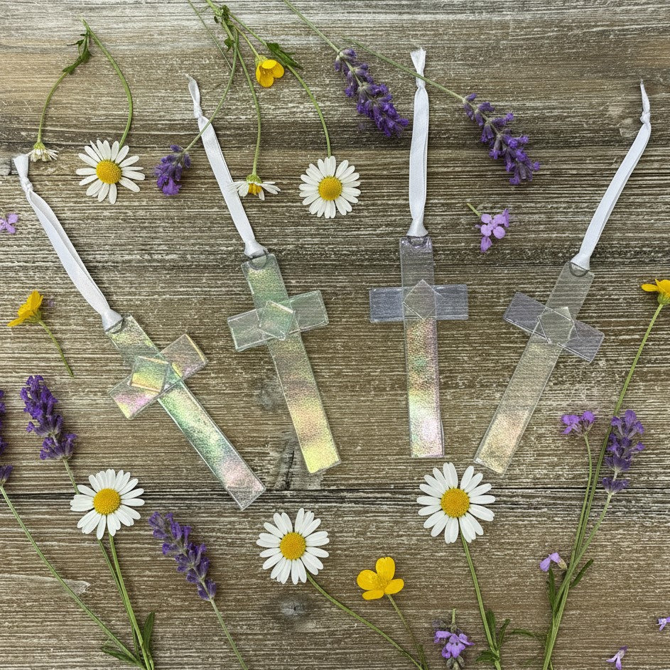 An assortment of clear iridescent crosses.