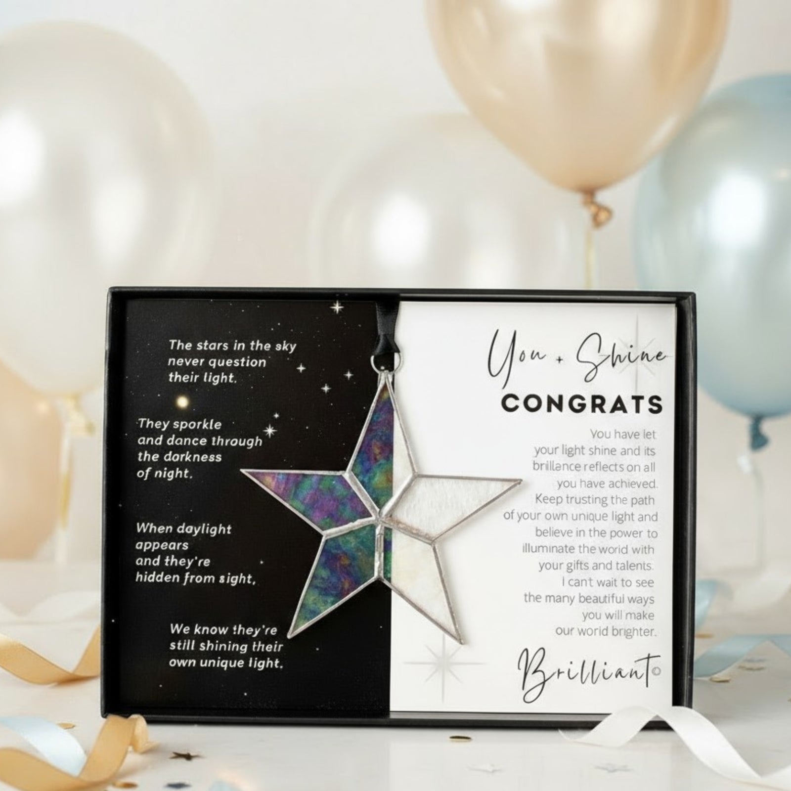 Handmade 4" clear iridescent stained glass star with silver edging, packaged with "You + Shine Congrats" sentiment in black gift box with clear lid.