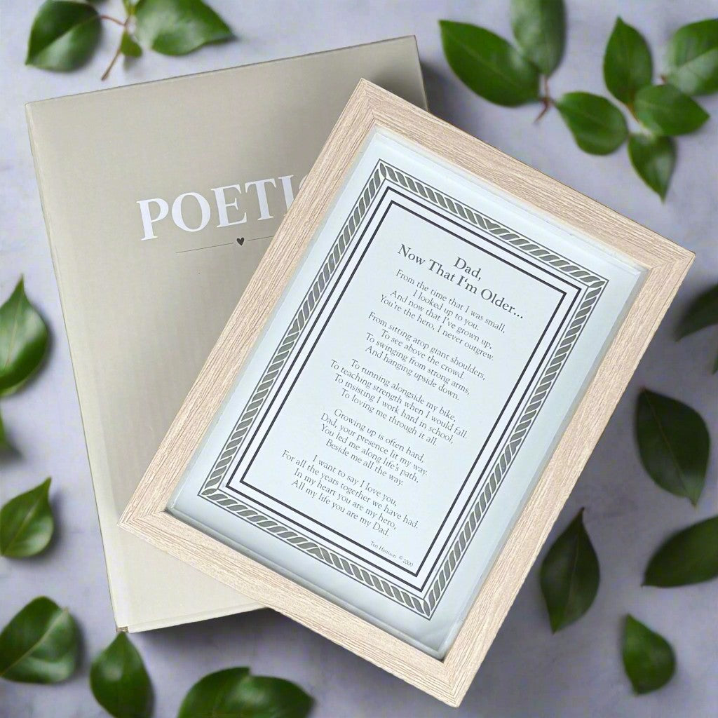 Framed poem titled &#39;Now That I&#39;m Older&#39; laying on top of its box.