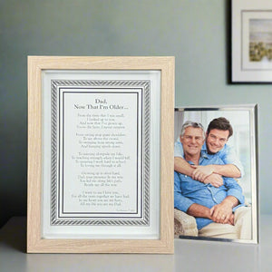 2 of 8:Framed poem for father in front of a framed photo of a father and son.