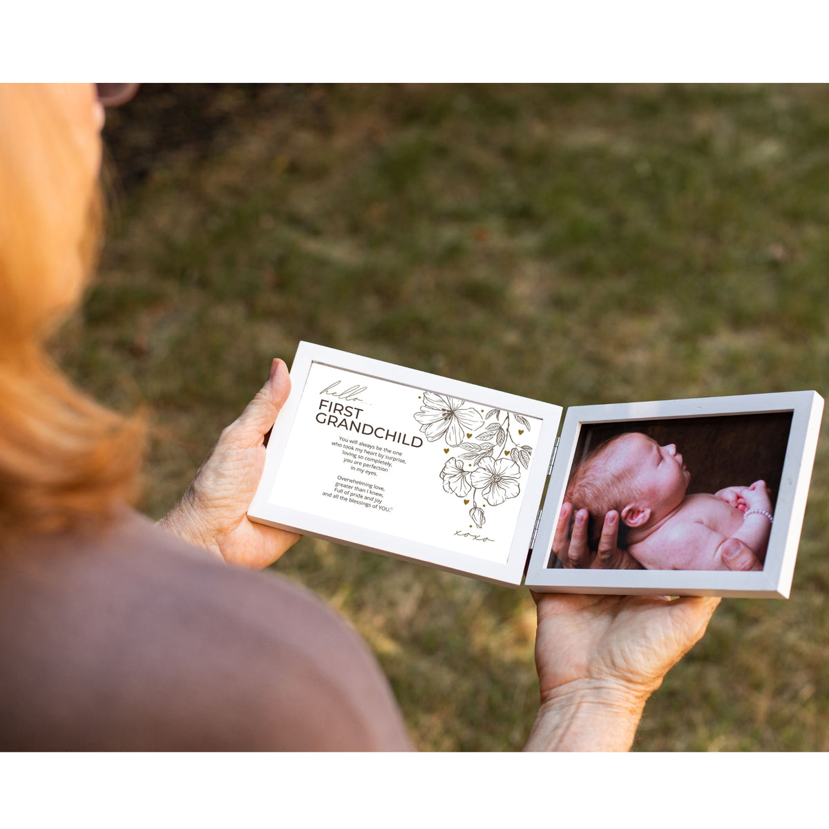 First Grandchild Frame being held in two hands by a Grandmother.