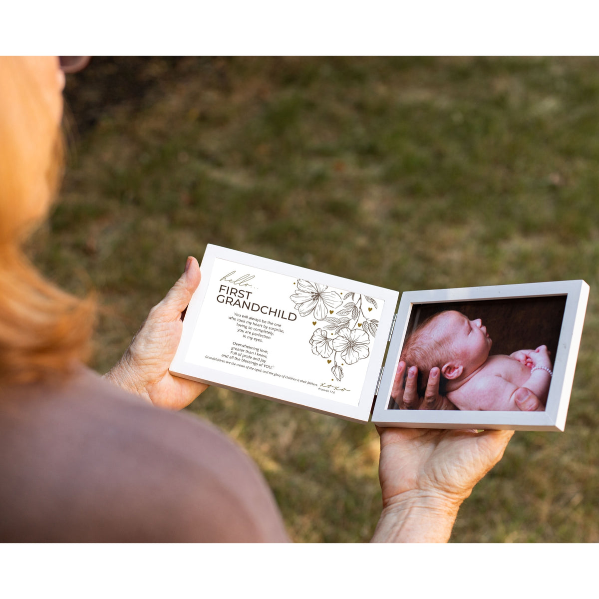 First Grandchild Frame being held in two hands by a Grandmother.