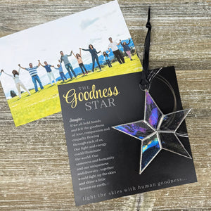 6 of 7:Goodness Star ornament and artwork with a photo featuring a group of people holding hands.