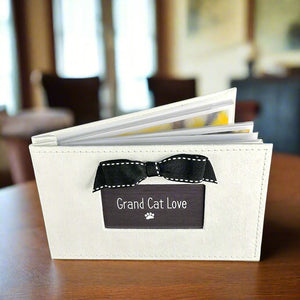 2 of 4:Grand Cat Love photo album standing up on table.
