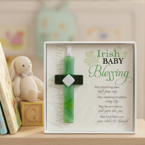 3 of 5:Green cross with 'Irish Baby Blessing' text in a decorative box on a shelf.