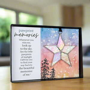 2 of 7:Angled view of the Pawprint Memories artwork and star ornament.