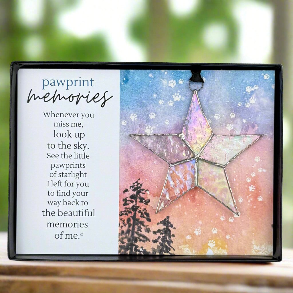 "Pawprint Memories" sentiment with a clear iridescent stained glass star ornament.