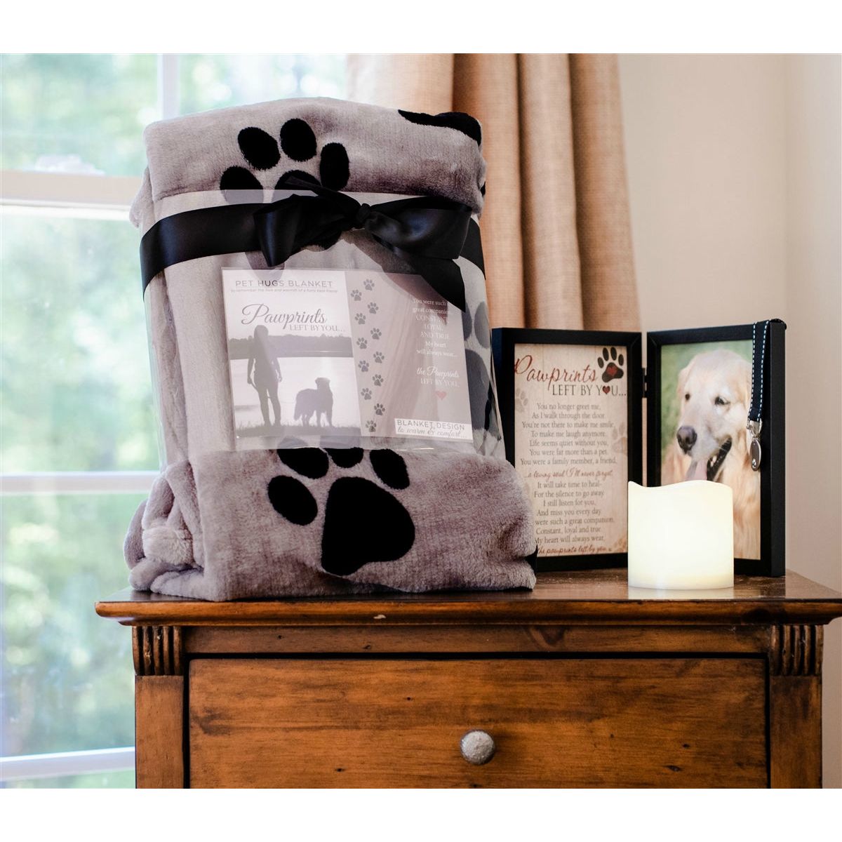 Pawprints Left by You blanket shown with the Pawprints Left by You memorial frame.