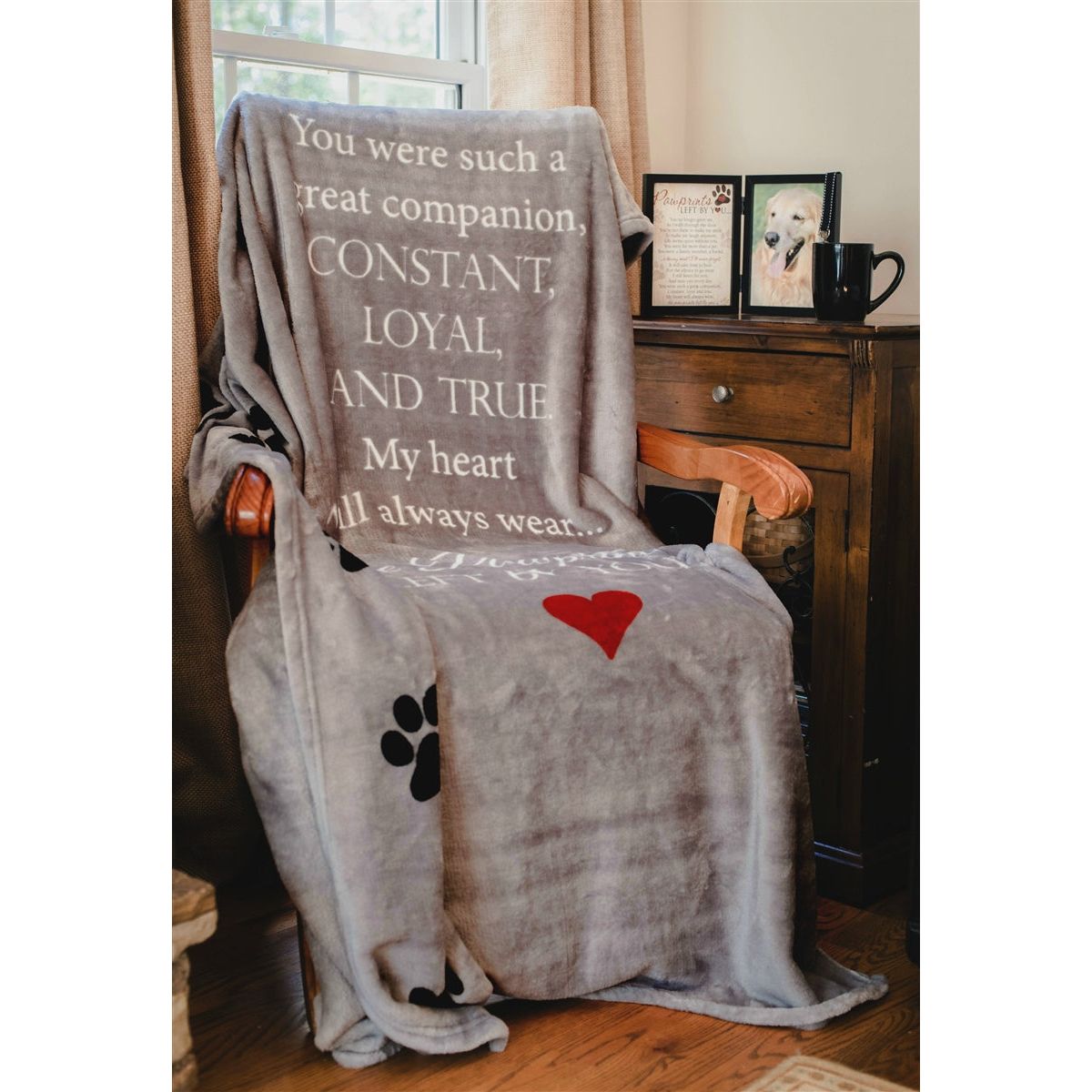 Pawprints blanket draped over a chair.