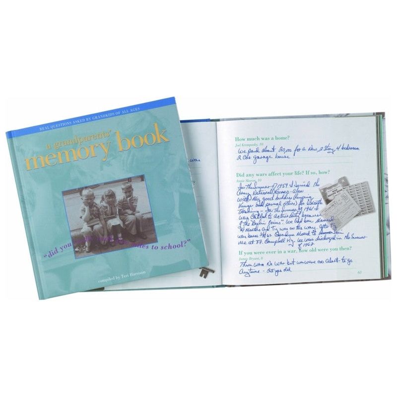A Grandparents' Memory Book closed sitting on top of a filled out memory book.