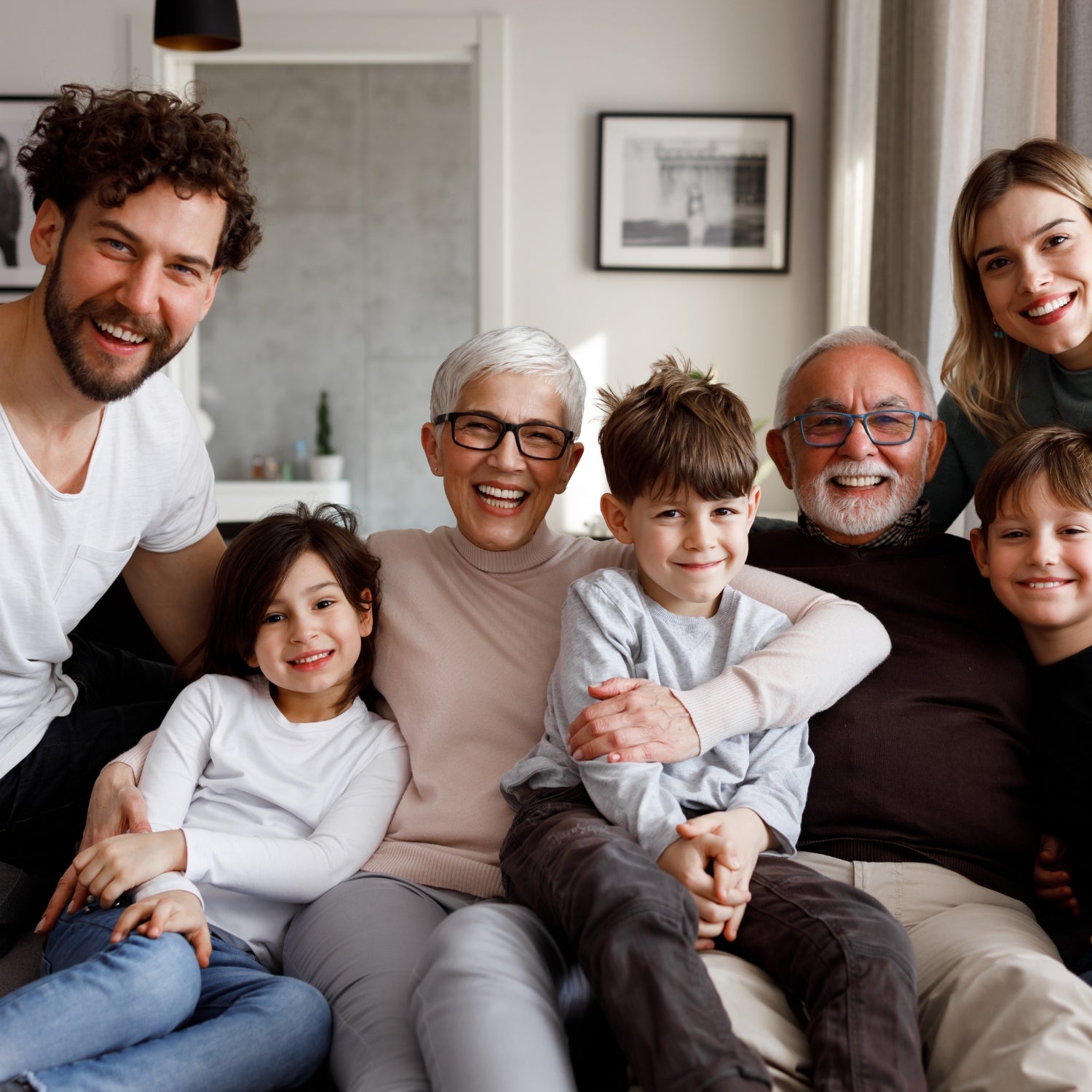 Happy family sitting together – Click to view our gifts by recipient