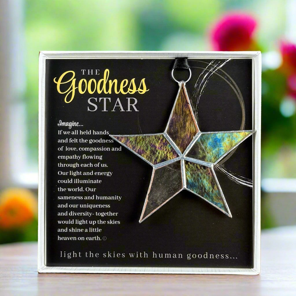 Handmade 4&quot; clear iridescent stained-glass star with silver edging, packaged with &quot;The Goodness star&quot; sentiment in white gift box with clear lid.