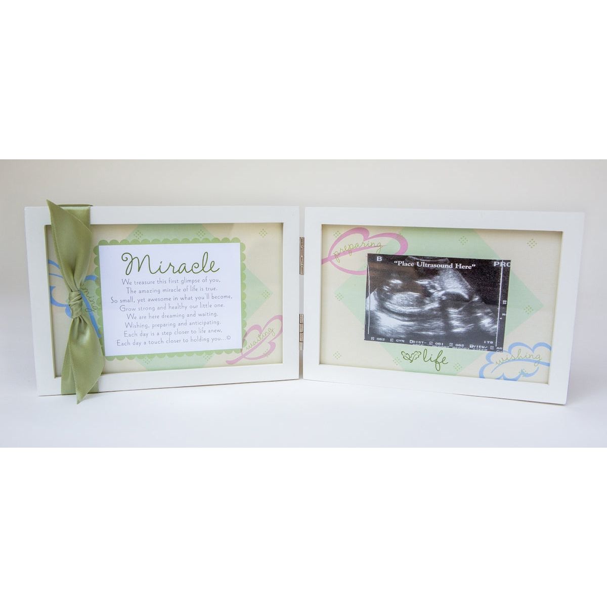 White 4x6 double wood frame with "Miracle" sentiment and green satin ribbon on the left and artwork and space for an ultrasound on the right.