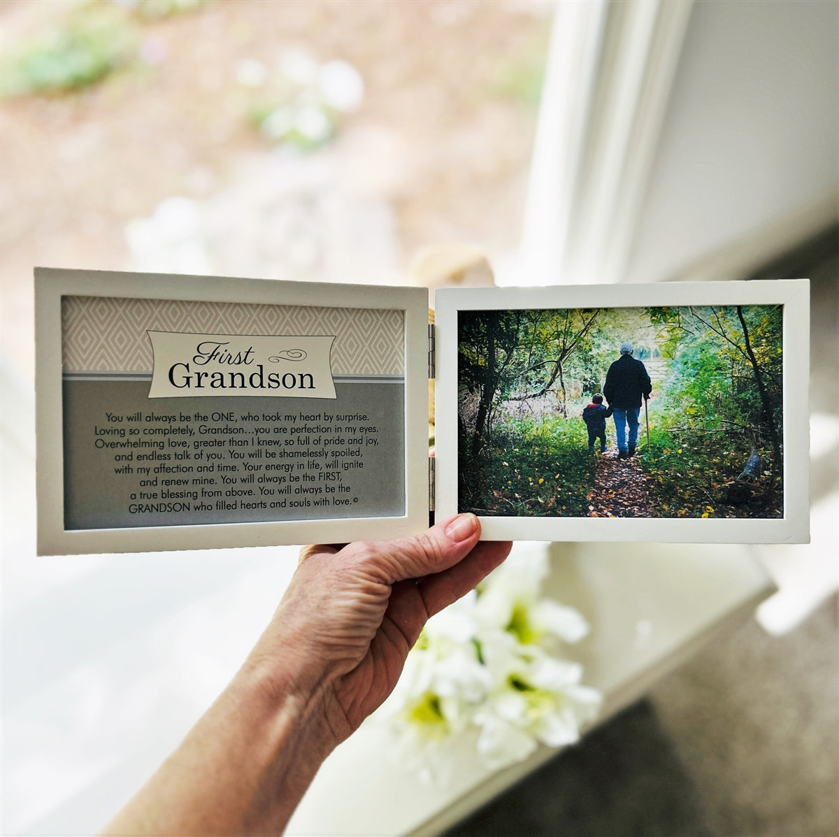 First Grandson frame being held in a hand.