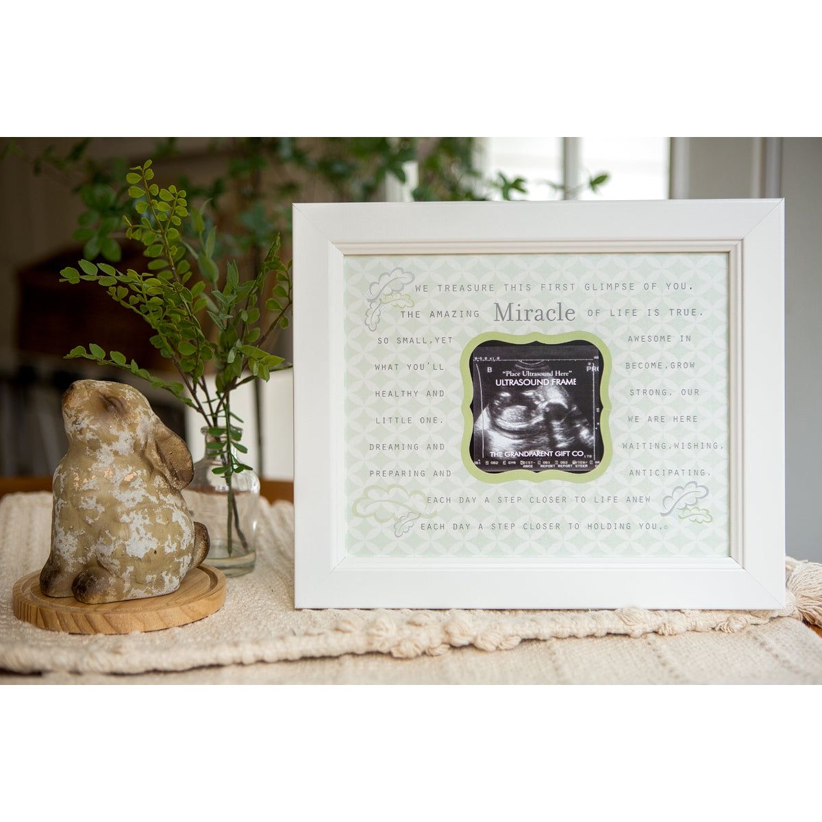 8x10 white frame. Artwork with "Miracle" poem. Artwork has a cut out for an ultrasound.