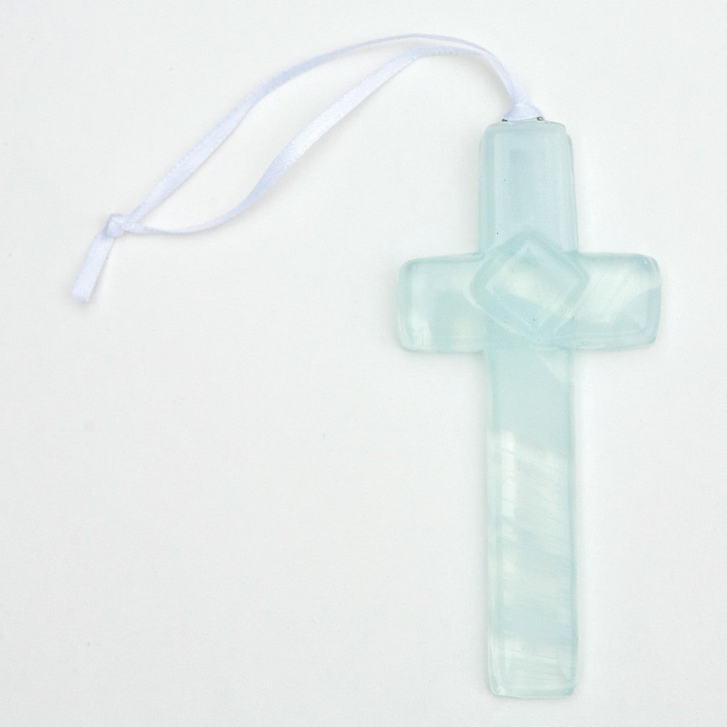 4 inch cross made of clear glass with white swirls throughout with white satin ribbon for hanging