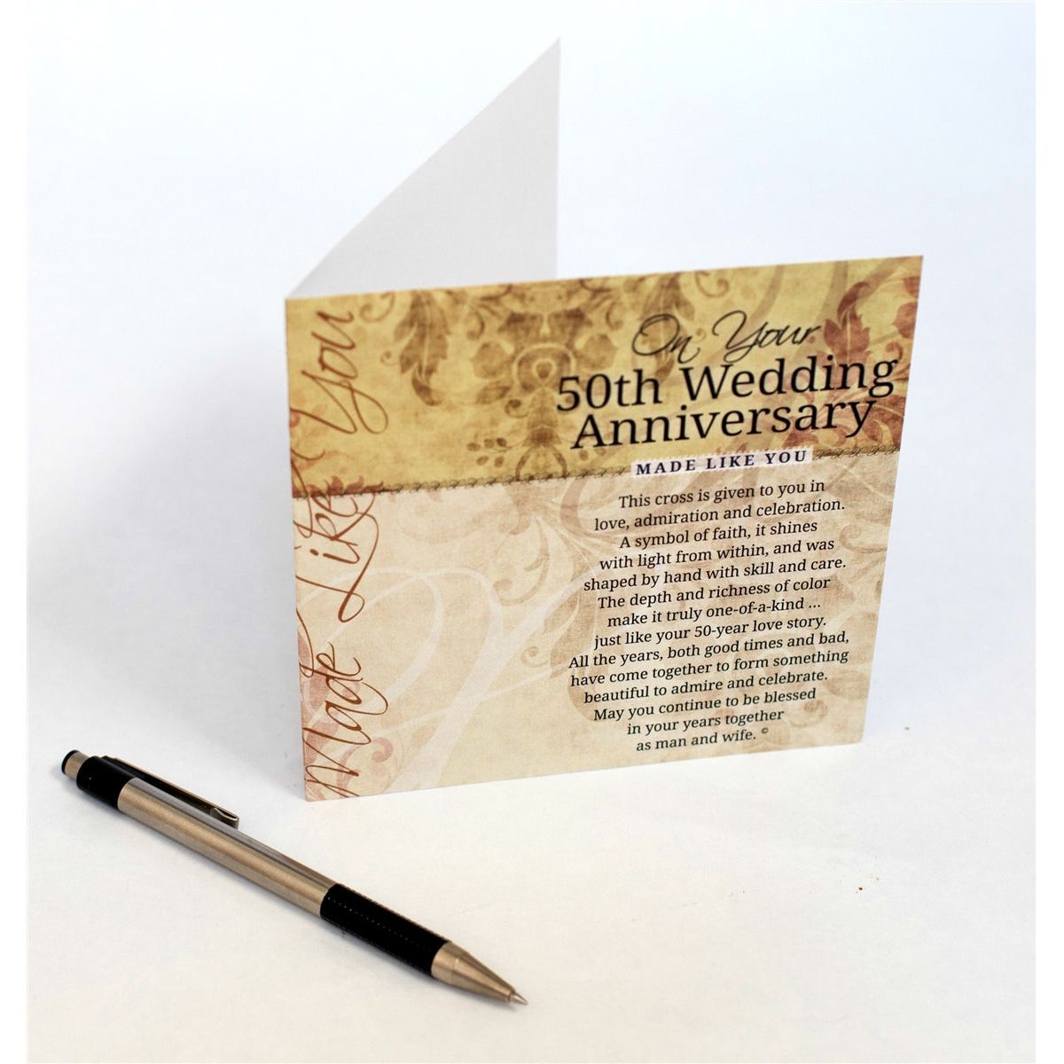 On Your 50th Wedding Anniversary card, open on a table showing the inside of the card with space to write a personal message