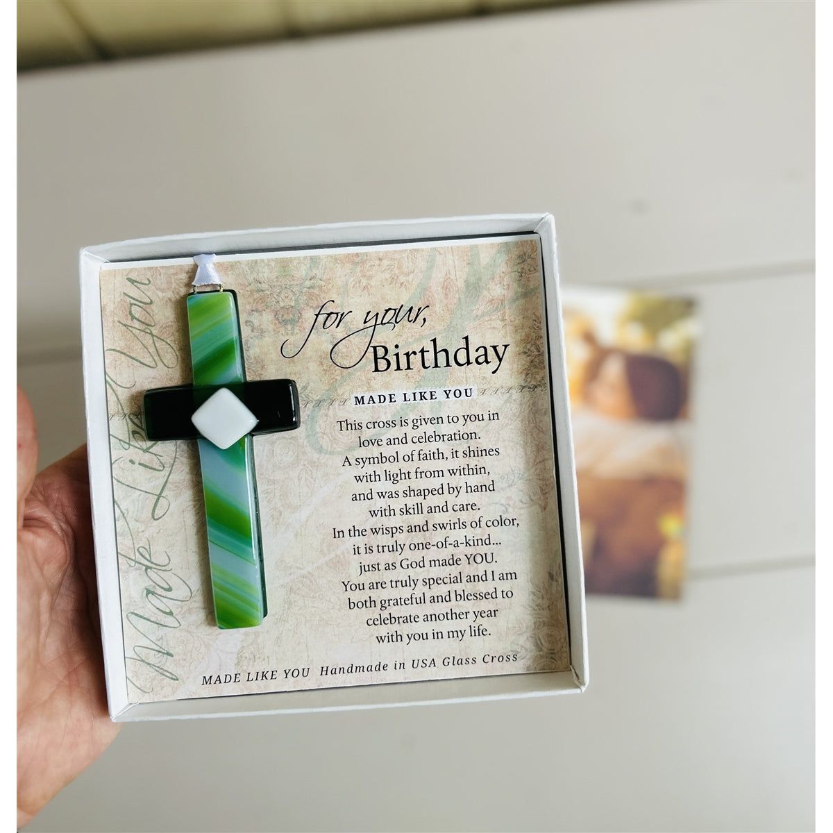 &quot;For Your, Birthday&quot; cross with a photo of friends hugging in background.