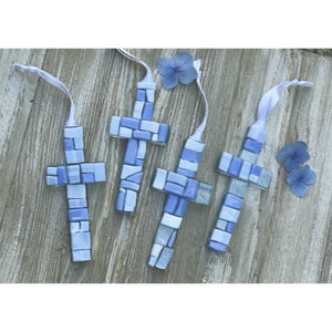 4 of 6:An assortment of blue mosaic crosses with varying shades of blue glass.