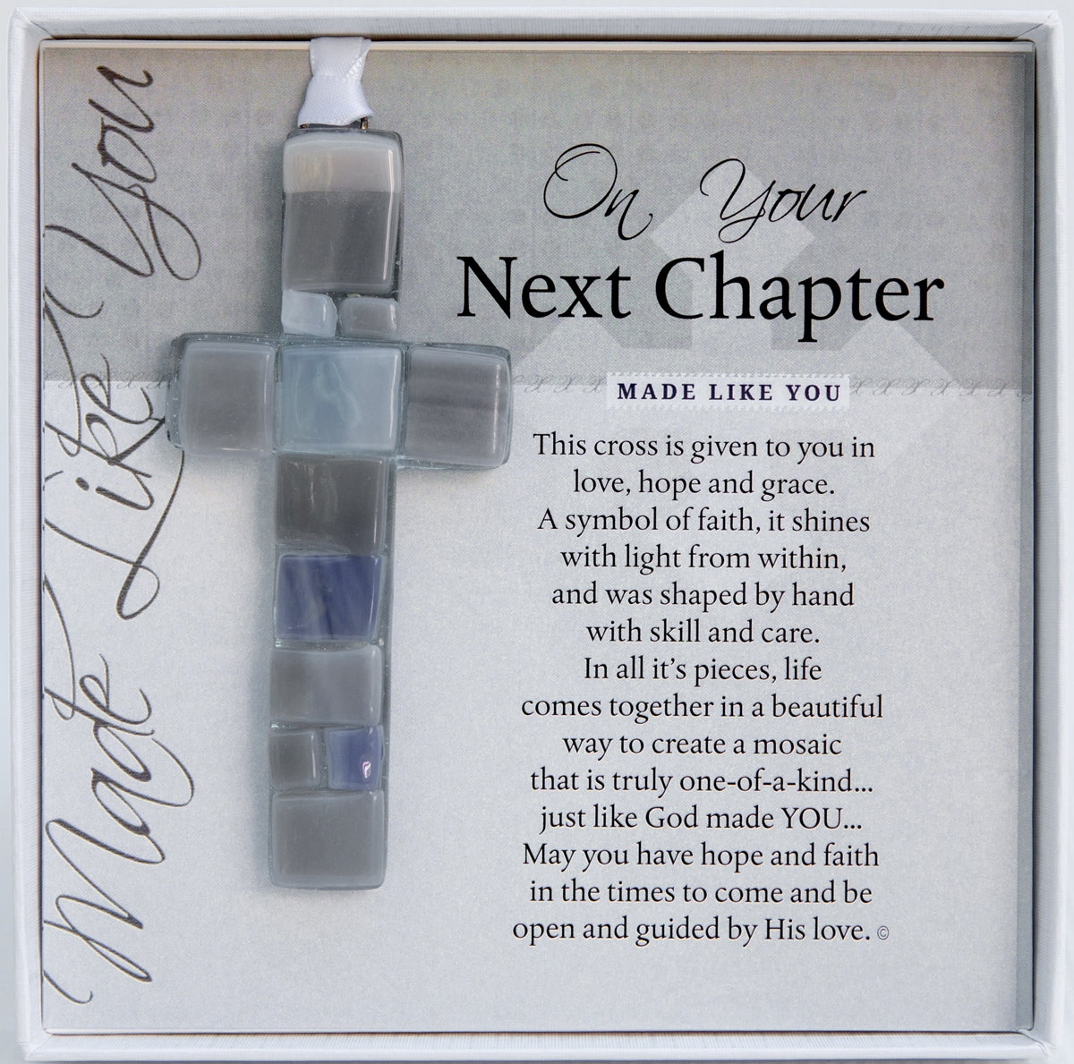 Next Chapter gift handmade 4" gray toned mosaic glass cross and sentiment in white box with clear lid.
