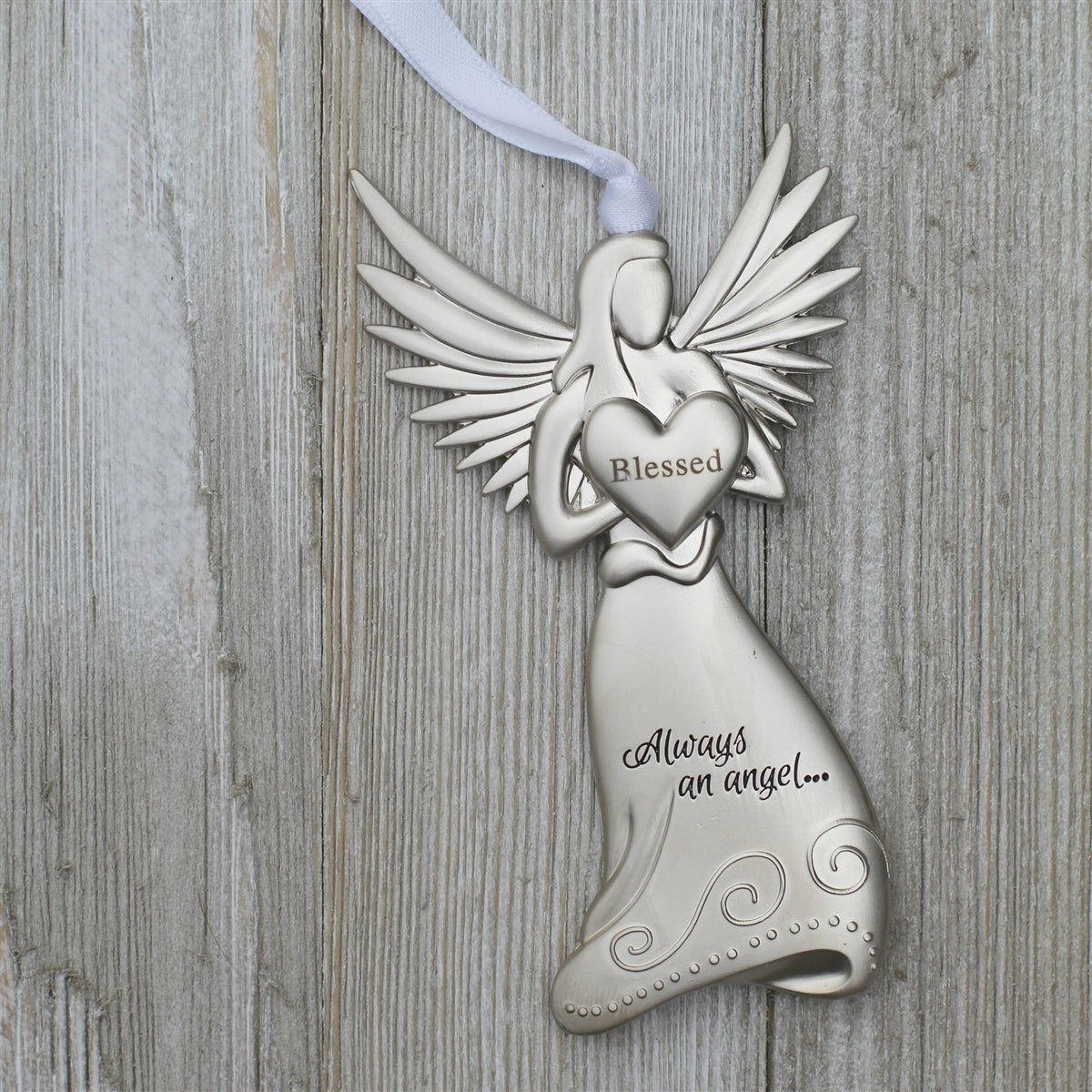 Silver toned metal angel holding a heart with the word &quot;Blessed&quot; in the center and &quot;Always and angel ...&quot; engraved on the angel&#39;s skirt.