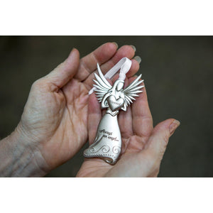 2 of 5:Blessed angel being held in the palm of a hand.
