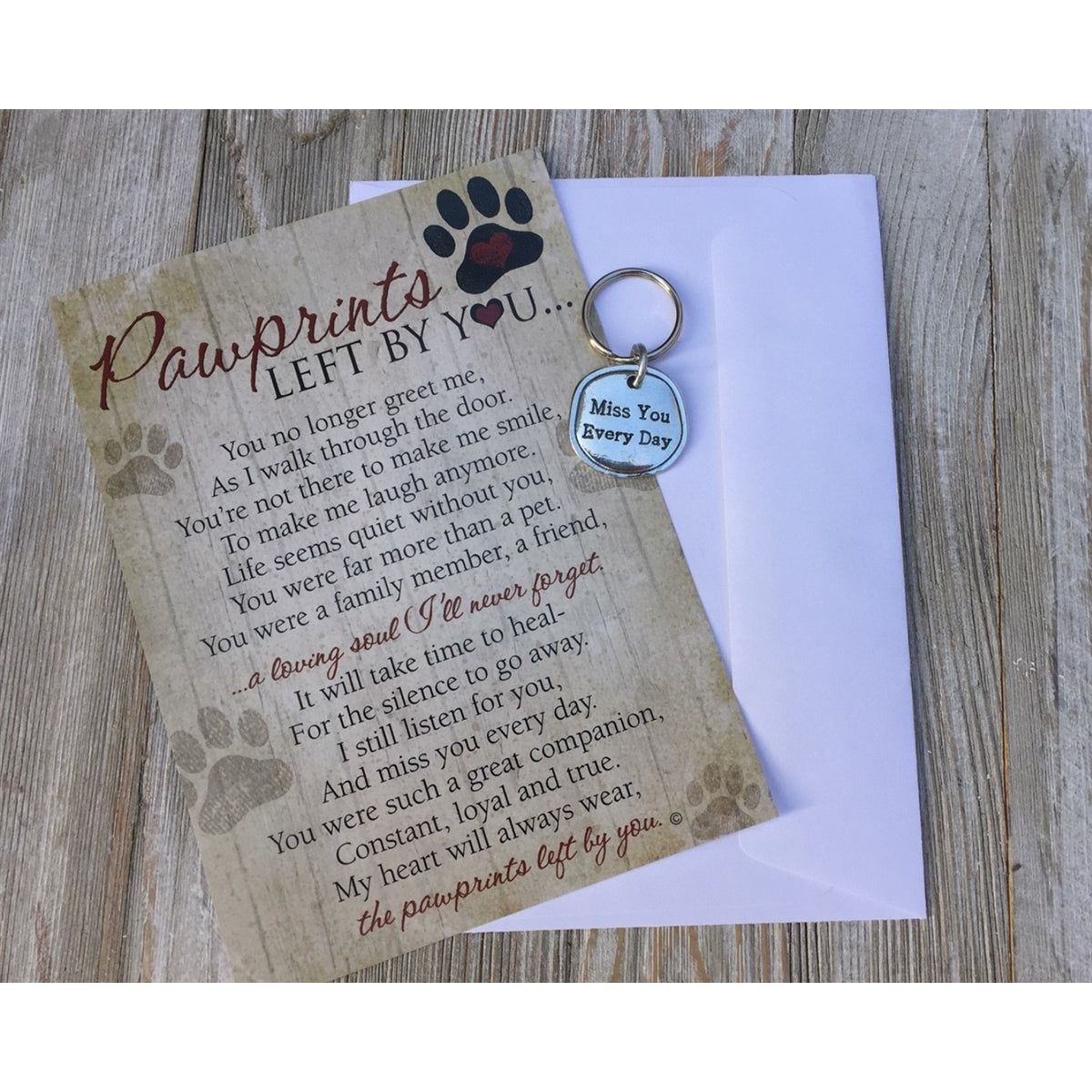 Keychain with pewter coin that says &quot;Miss You Every Day&quot; packaged with a notecard with the &quot;Pawprints Left By You&quot; sentiment and an envelope.