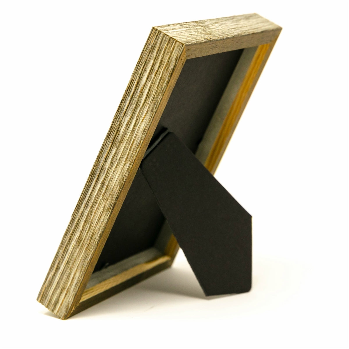 Side view of farmhouse wood frame showing wood grain and easel back.