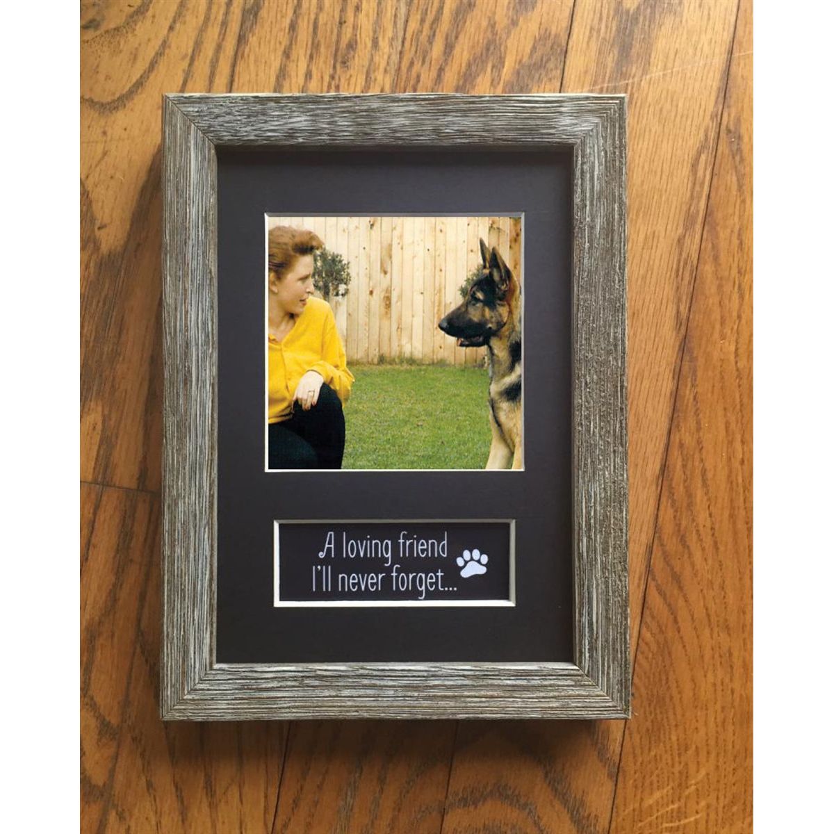 Pet memorial frame with photo of Teri Harrison and Kip, her late German Shepherd