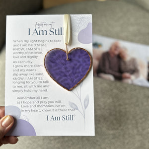 3 of 5:I am Still sentiment and heart being held in a hand